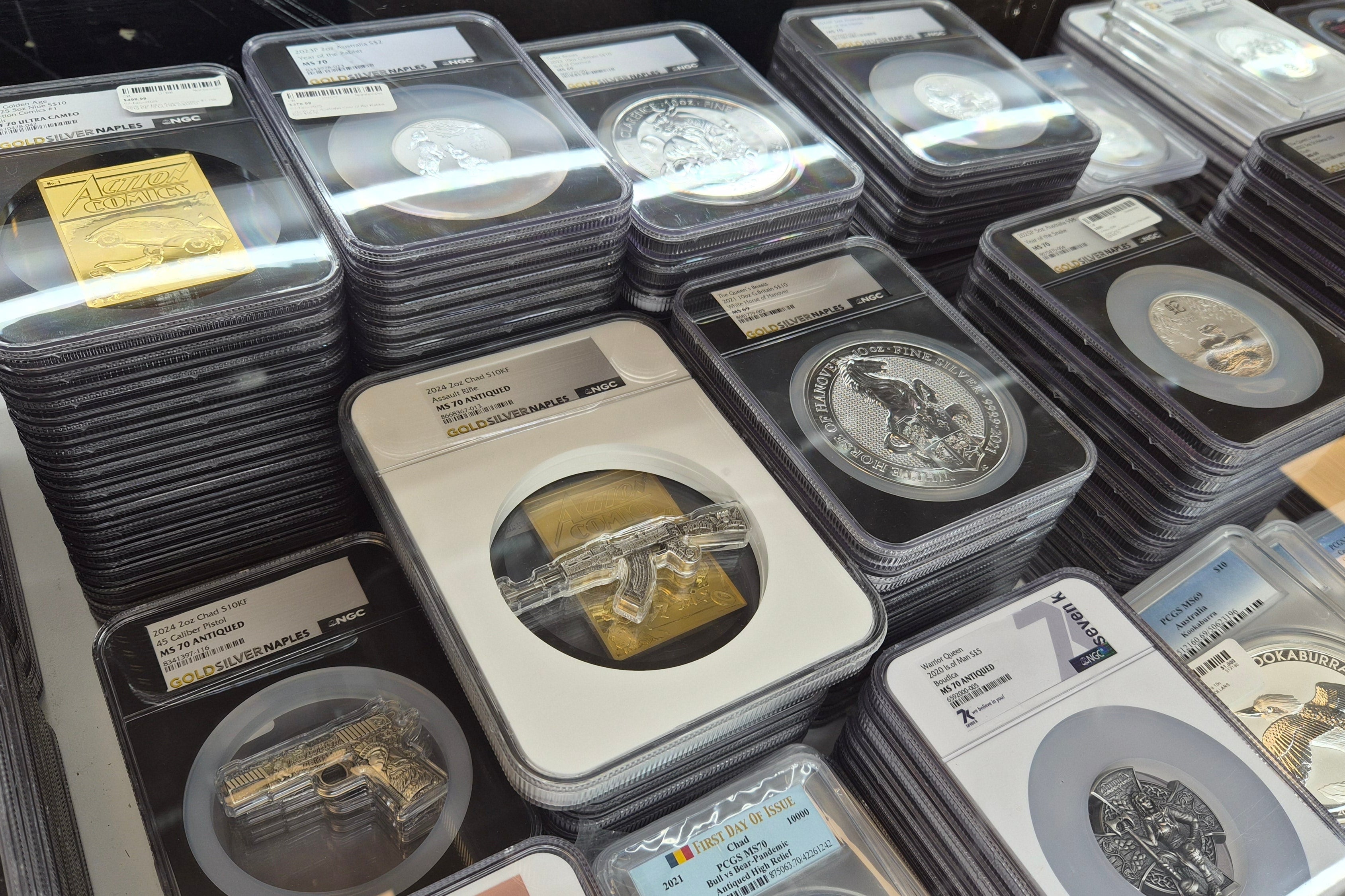 Collection of coins in protective cases on a table